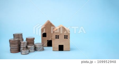 Stack coins with house model background. business finance investment and savings insurance home loan development concept. 109952948