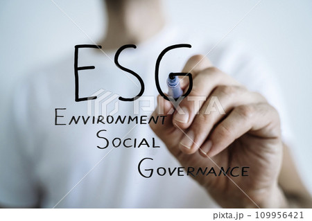 ESG strategy concept. Environmental, sustainable, governance. Businessman writes ESG 109956421