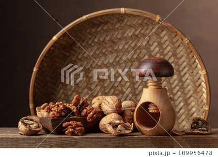 Walnuts on an old wooden table. Walnuts on an old wooden table. 109956478