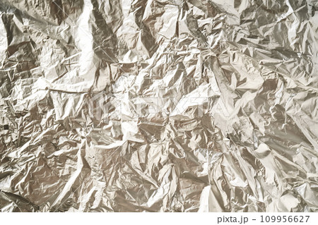 Abstract background made of crumpled silver foil. 109956627