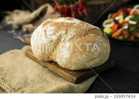 Loaf of bread in the rustic kitchen Loaf of bread in the rustic kitchen 109957614