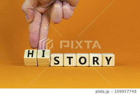 Story and history symbol. Historic turns a cube, changes the word story to history. Beautiful orange table, orange background. Business, historical and story or history concept. Copy space. Story and history symbol. Historic turns a cube, changes the word story to history. Beautiful orange table, orange background. Business, historical and story or history concept. Copy space. 109957748