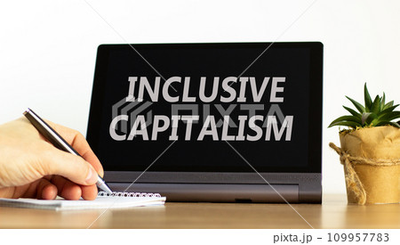 Inclusive capitalism symbol. Concept words Inclusive capitalism on beautiful black tablet. Beautiful white background. Businessman hand. Business inclusive capitalism concept. Copy space. Inclusive capitalism symbol. Concept words Inclusive capitalism on beautiful black tablet. Beautiful white background. Businessman hand. Business inclusive capitalism concept. Copy space. 109957783