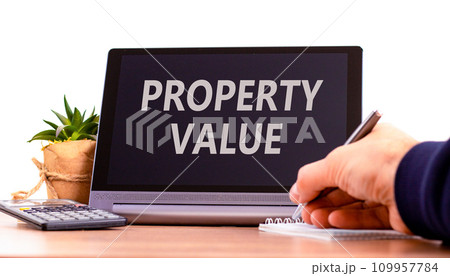 Property value symbol. Concept words Property value on beautiful black tablet. Beautiful white background. Calculator. Businessman hand. Business property value concept. Copy space. Property value symbol. Concept words Property value on beautiful black tablet. Beautiful white background. Calculator. Businessman hand. Business property value concept. Copy space. 109957784
