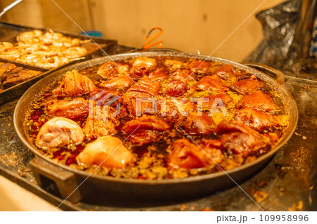 Festival of street food at a Christmas Market stall in Krakow, Poland. Traditional Polish street food. Festival of street food at a Christmas Market stall in Krakow, Poland. Traditional Polish street food. 109958996