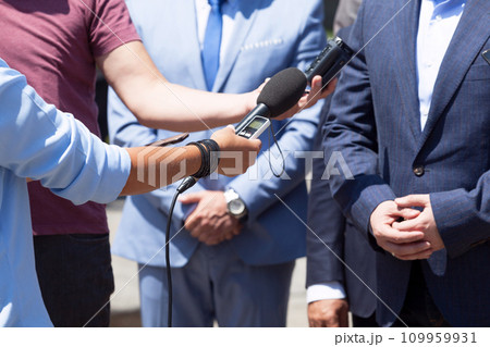 Reporters making media interview with unrecognizable businessman or politician 109959931