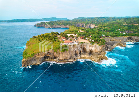 Cinematic aerial landscape shots of the beautiful island of Nusa Penida. Huge cliffs by the shoreline and hidden dream beaches with clear water. Cinematic aerial landscape shots of the beautiful island of Nusa Penida. Huge cliffs by the shoreline and hidden dream beaches with clear water. 109960111