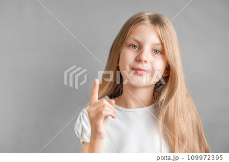 Adorable little girl direct finger up 109972395