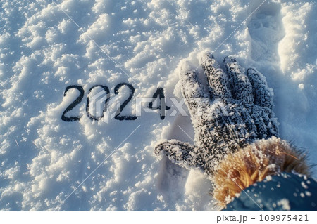 Hand writting of 2024 on snow Happy New Year concept background. Hand writting of 2024 on snow Happy New Year concept background. 109975421