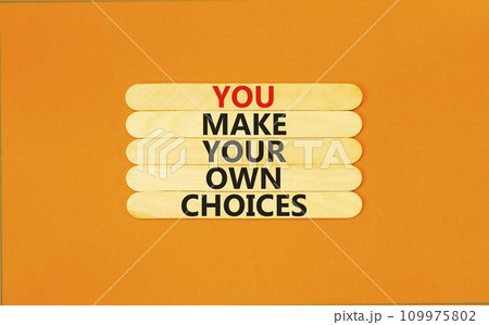 You make your own choice symbol. Concept words You make your own choice on wooden stick. Beautiful orange table orange background. Business you make your own choice concept. Copy space. 109975802