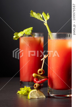Cocktail Bloody Mary on a black background. Cocktail Bloody Mary on a black background. 109979387