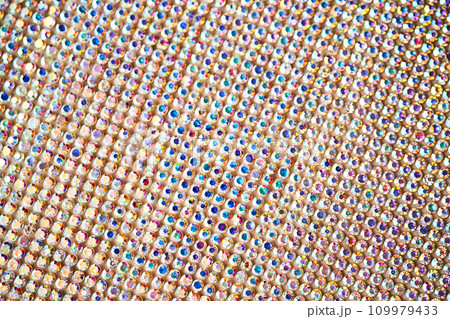 Abstract background made of rhinestones shimmering in the light. Abstract background made of rhinestones shimmering in the light. 109979433