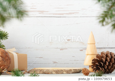 Wooden podium and christmas decorations on grey background. 109979653