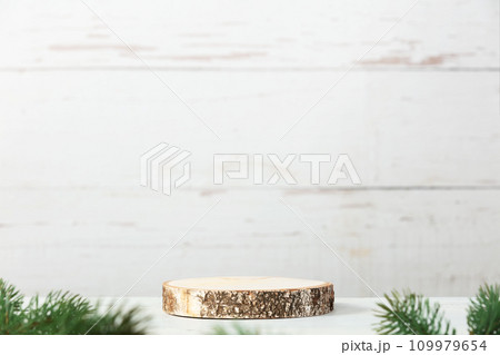 Wooden podium and christmas decorations on grey background. 109979654