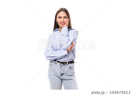 portrait of a stylish well-groomed young brunette caucasian woman with straight hair dressed in a 109979822
