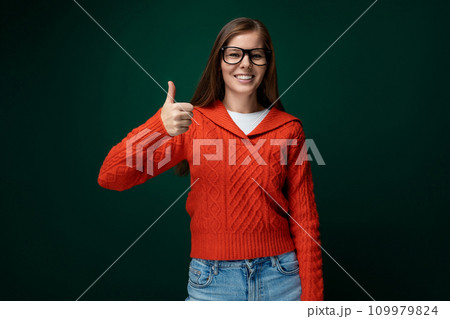 Smart Caucasian woman with brown straight hair and glasses on green background Smart Caucasian woman with brown straight hair and glasses on green background 109979824