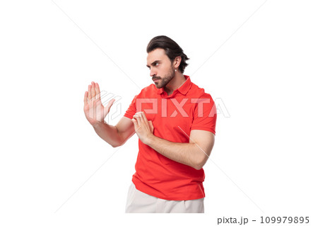young handsome european brunette man with a beard dressed in a red t-shirt with a mockup actively young handsome european brunette man with a beard dressed in a red t-shirt with a mockup actively 109979895