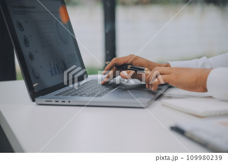 Business people meeting at office writing notes about sticky notes Laptop,tablet Planning and Brainstorming Strategies of Colleagues in office 109980239