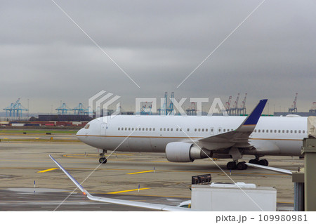 Passenger plane is taxiing on runway as it prepares to depart Passenger plane is taxiing on runway as it prepares to depart 109980981