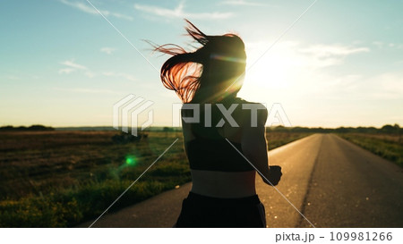 silhouette sports girl running along road sunset, legs close-up, runner fitness sport, triathlon exercise, running fast movements, endurance training, outdoor exercise, confident motivated beautiful silhouette sports girl running along road sunset, legs close-up, runner fitness sport, triathlon exercise, running fast movements, endurance training, outdoor exercise, confident motivated beautiful 109981266