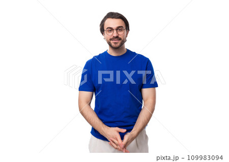 young confident brunette man with a beard dressed in a blue t-shirt on a studio white background young confident brunette man with a beard dressed in a blue t-shirt on a studio white background 109983094