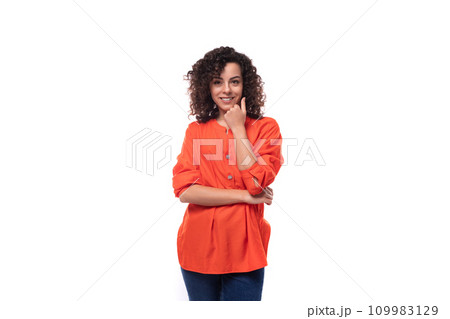 young dreamy caucasian business woman with wavy hair dressed in an orange blouse on a white young dreamy caucasian business woman with wavy hair dressed in an orange blouse on a white 109983129