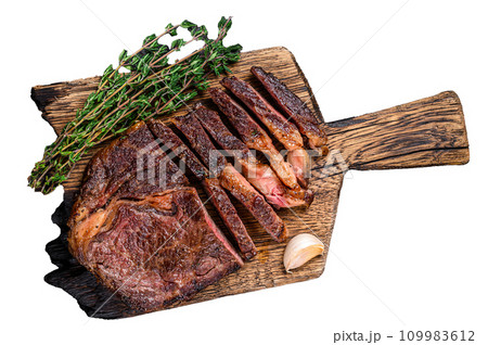 Roasted and sliced rib eye beef meat steak Isolated on white background, top view. Roasted and sliced rib eye beef meat steak Isolated on white background, top view. 109983612