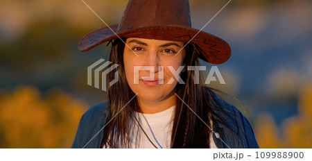 Close up shot of a young woman in a western style outfit in the Arizona desert Close up shot of a young woman in a western style outfit in the Arizona desert 109988900