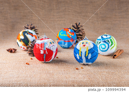 Exquisite handmade Christmas bubble toy from beads, also known as a Christmas globe or Christmas bulb, is a part of holiday decor 109994394