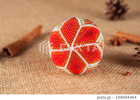 Exquisite handmade Christmas bubble toy from beads, also known as a Christmas globe or Christmas bulb, is a part of holiday decor Exquisite handmade Christmas bubble toy from beads, also known as a Christmas globe or Christmas bulb, is a part of holiday decor 109994464