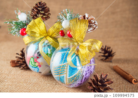 Exquisite handmade Christmas bubble toy from beads, also known as a Christmas globe or Christmas bulb, is a part of holiday decor Exquisite handmade Christmas bubble toy from beads, also known as a Christmas globe or Christmas bulb, is a part of holiday decor 109994575