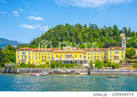 Bellagio town at Como Lake on sunny summer day. Idyllic view from ferry. Lombardy, Italy Bellagio town at Como Lake on sunny summer day. Idyllic view from ferry. Lombardy, Italy 109999079