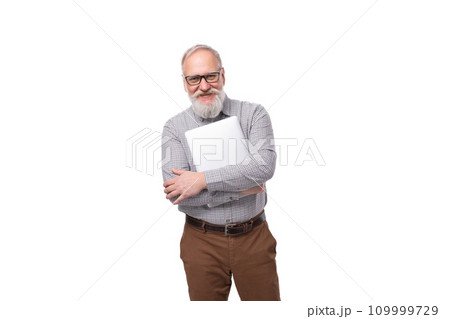 handsome elderly boss man with a white beard and mustache dressed in a shirt and trousers holds a handsome elderly boss man with a white beard and mustache dressed in a shirt and trousers holds a 109999729