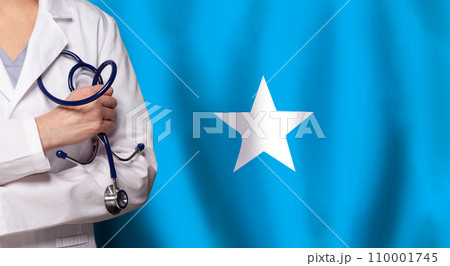 Somali medicine and healthcare concept. Doctor close up against flag of Somalia background 110001745