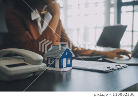 buy or sell real estate mortgage, Sale representative offer house purchase contract to buy a house or apartment and mortgage Money and Financial Concepts buy or sell real estate mortgage, Sale representative offer house purchase contract to buy a house or apartment and mortgage Money and Financial Concepts 110002236