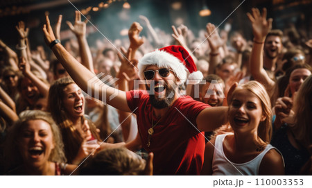 A lively Santa Claus party, guests in Santa hats dancing and enjoying, vibrant and energetic atmosphere 110003353