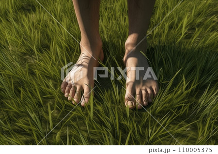 Walking barefoot on green grass Walking barefoot on green grass 110005375