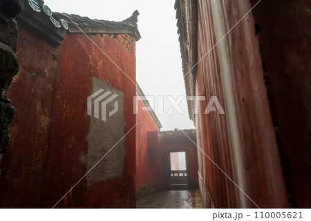 The mysterious ancient building complex of Wudang Mountain in the fog. 110005621