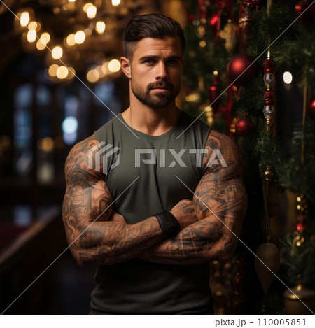 A bodybuilder's flexed arm with a Christmas tattoo, against a backdrop of green festive decorations, showcasing a blend of fitness and holiday spirit A bodybuilder's flexed arm with a Christmas tattoo, against a backdrop of green festive decorations, showcasing a blend of fitness and holiday spirit 110005851
