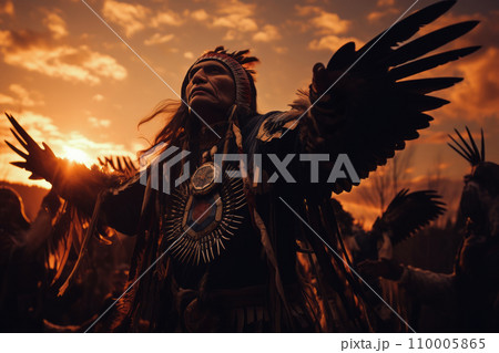 Native American dancers performing a ceremonial eagle dance at sunset. Native American dancers performing a ceremonial eagle dance at sunset. 110005865