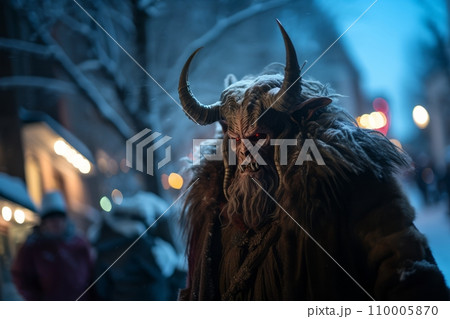 Artistic close-up of Krampus's face, focusing on his glowing eyes and gnarled horns, a blurred backdrop of winter night adds to the eerie legend Artistic close-up of Krampus's face, focusing on his glowing eyes and gnarled horns, a blurred backdrop of winter night adds to the eerie legend 110005870