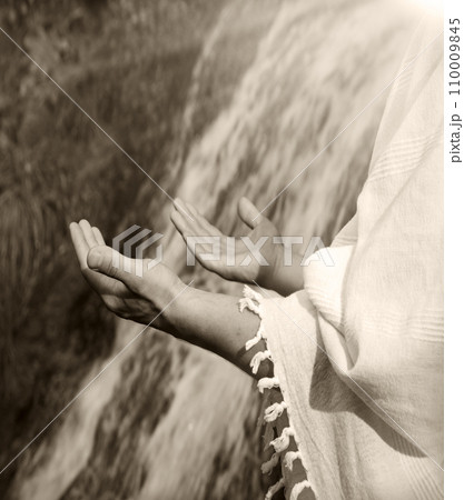 Man praying at the river Man praying at the river 110009845