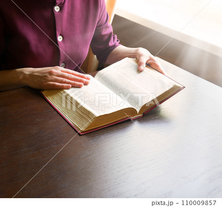 Woman's hands holding a bible Woman's hands holding a bible 110009857
