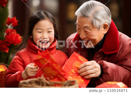 Grandfather giving red envelope to his granddaughter, celebrating Chinese new year and lunar new year with family. Generative AI Grandfather giving red envelope to his granddaughter, celebrating Chinese new year and lunar new year with family. Generative AI 110016871