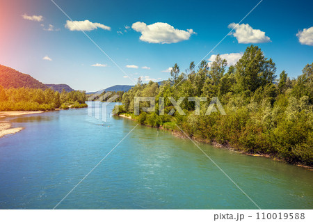 View of mountain valley and river. Springtime. Tisza (Tysa, Tisa) river. Khust, Zakarpattia Oblast Ukraine, Europe View of mountain valley and river. Springtime. Tisza (Tysa, Tisa) river. Khust, Zakarpattia Oblast Ukraine, Europe 110019588