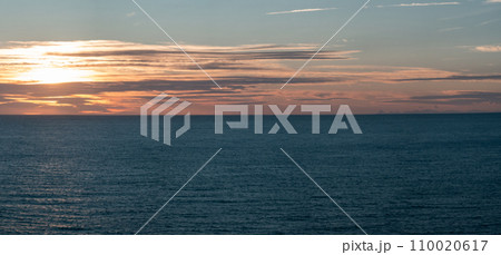 Serene Sunset Over Calm Ocean Waters Captured Beautifully Serene Sunset Over Calm Ocean Waters Captured Beautifully 110020617