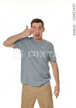 man covering eyes with hands on white background 110021457