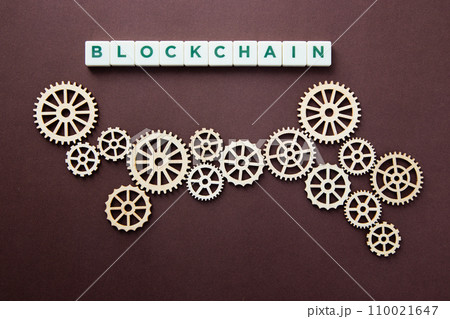 Wooden gears with word Blockchain. Cryptocurrency concept Wooden gears with word Blockchain. Cryptocurrency concept 110021647
