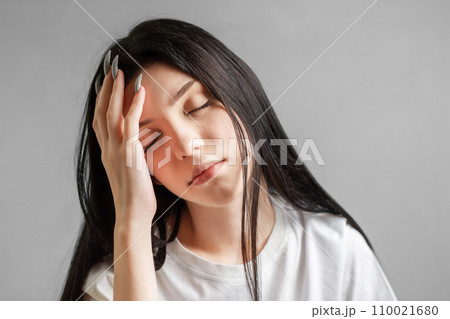 Portrait of a young girl who looks sad. Portrait of a young girl who looks sad. 110021680