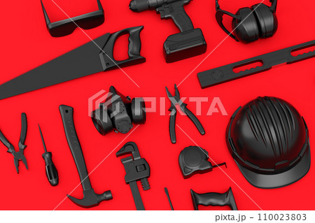 Top view of monochrome construction tools for repair on red background 110023803